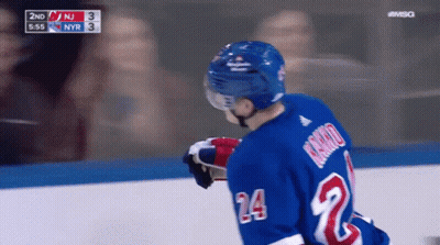 Hockey Player In Blue Jersey Number 24 GIF