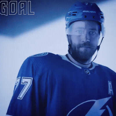 Hockey Player In Blue Jersey Number 7 GIF