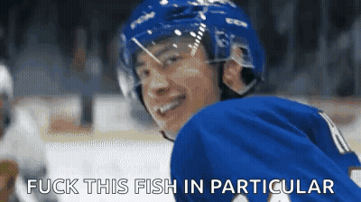 Hockey Player In Blue Jersey Smiling Says Fuck This Fish In Particular GIF