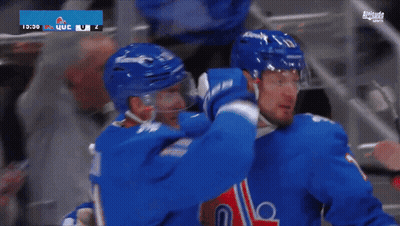 Hockey Player In Blue Jersey With A GIF