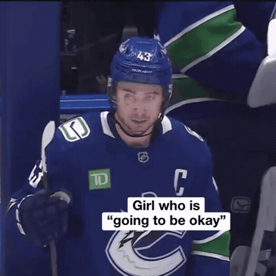 Hockey Player In Blue Jersey With C GIF