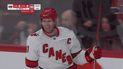 Hockey Player In Canes Jersey Smiling GIF