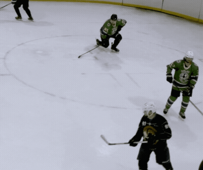 Hockey Player In Dallas Jersey Holding Puck GIF