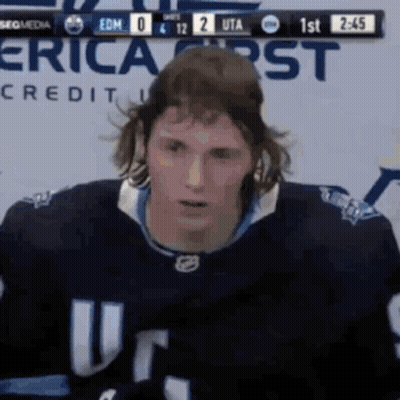 Hockey Player In Front Of Erica Credit Scoreboard GIF