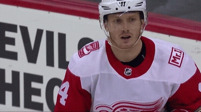 Hockey Player In Front Of Evil Sign GIF