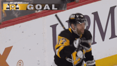 Hockey Player In Front Of Goal Sign GIF