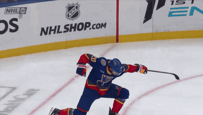 Hockey Player In Front Of NHL Shop Sign GIF