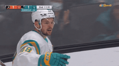 Hockey Player In Front Of Powerplay Scoreboard GIF