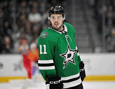 Hockey Player In Green Jersey Number 11 GIF