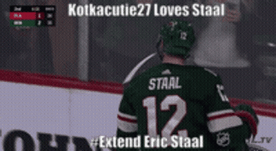 Hockey Player In Green Jersey Number 12 GIF