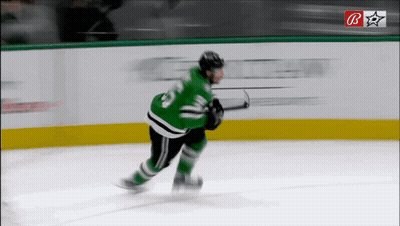 Hockey Player In Green Jersey Number 23 GIF