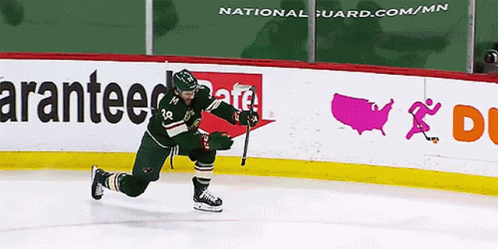 Hockey Player In Green Uniform Number 20 GIF