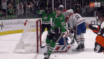 Hockey Player In Green Uniform Number 21 GIF
