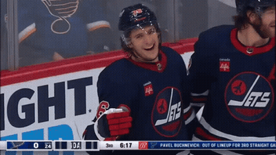 Hockey Player In Jets Jersey In Front Of Canada Life Sign GIF