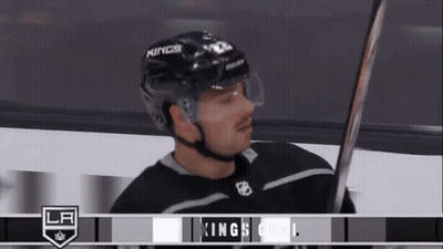 Hockey Player In Kings Helmet Holding Hockey Stick GIF