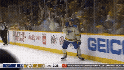Hockey Player In Number 10 Jersey Lying On Ice GIF