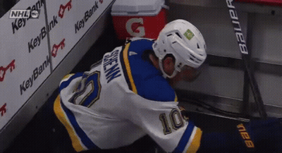 Hockey Player In Number 10 Jersey Lying On Ice GIF