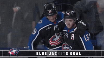 Hockey Player In Number 10 Jersey Next To Player GIF