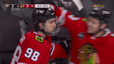 Hockey Player In Number 8 Jersey Next To Another Player GIF