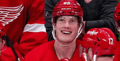 Hockey Player In Red Bauer Helmet Smiling GIF
