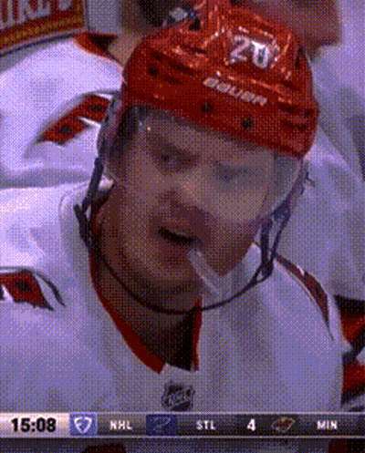 Hockey Player In Red Helmet Number 20 GIF