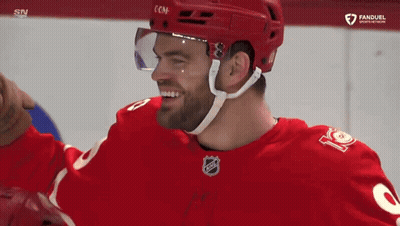 Hockey Player In Red Jersey Number 12 GIF