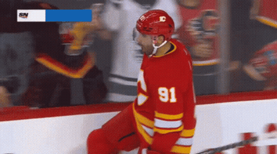 Hockey Player In Red Jersey Number 91 GIF