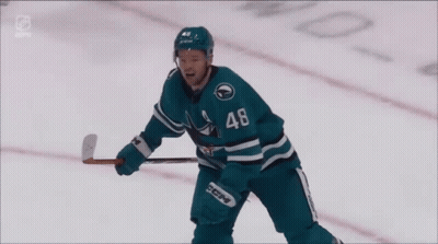 Hockey Player In Sharks Jersey Raising Arms GIF