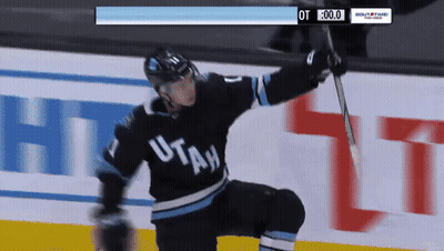 Hockey Player In Utah Jersey Holding Stick GIF