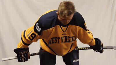 Hockey Player In West Virginia Jersey Holding Stick GIF
