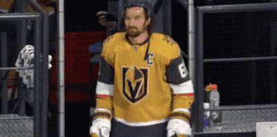 Hockey Player In Yellow Jersey And Gloves In Locker Room GIF