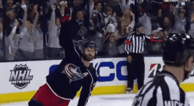 Hockey Player Jumping As Referee Looks On GIF