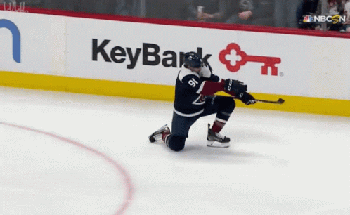 Hockey Player Kneeling In Front Of KeyBank Sign GIF