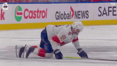 Hockey Player Kneeling On Ice In Front Of Safeway Banner GIF