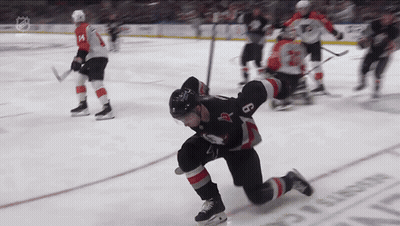 Hockey Player Kneeling On Ice With Number 8 GIF