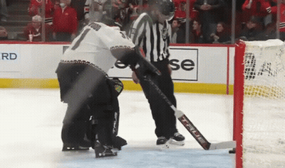 Hockey Player Kneeling On Ice With Referee GIF