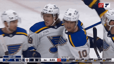 Hockey Player Number 10 Surrounded By Teammates GIF