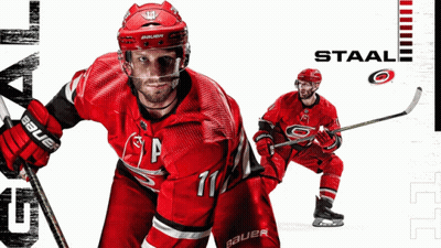 Hockey Player Number 11 Holding Hockey Stick GIF