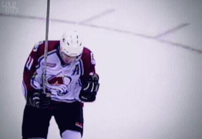 Hockey Player Number 11 Holding Stick GIF