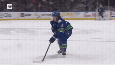 Hockey Player Number 12 Skating GIF