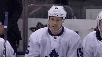 Hockey Player Number 15 Sitting On Bench GIF