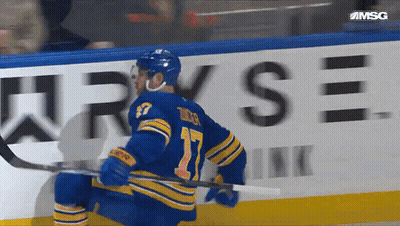 Hockey Player Number 17 Holding Stick GIF