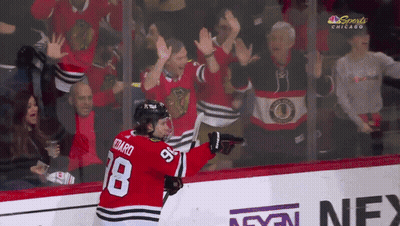 Hockey Player Number 18 In Front Of Crowd GIF