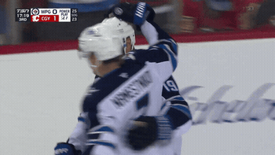 Hockey Player Number 19 Being Hugged GIF