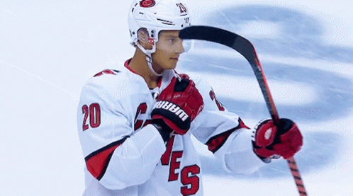 Hockey Player Number 20 Holding Hockey Stick GIF