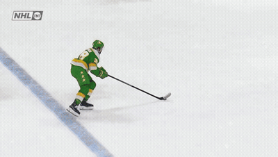 Hockey Player Number 20 Holding Stick GIF