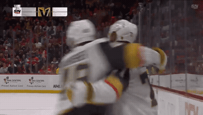 Hockey Player Number 21 In Front Of ESS UPR Sign GIF