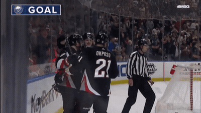 Hockey Player Number 21 Surrounded By Players GIF