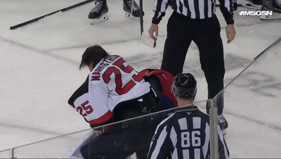 Hockey Player Number 25 Laying On Ice GIF