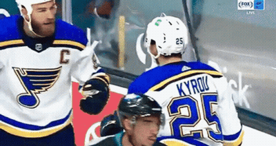 Hockey Player Number 25 Talking To Another GIF